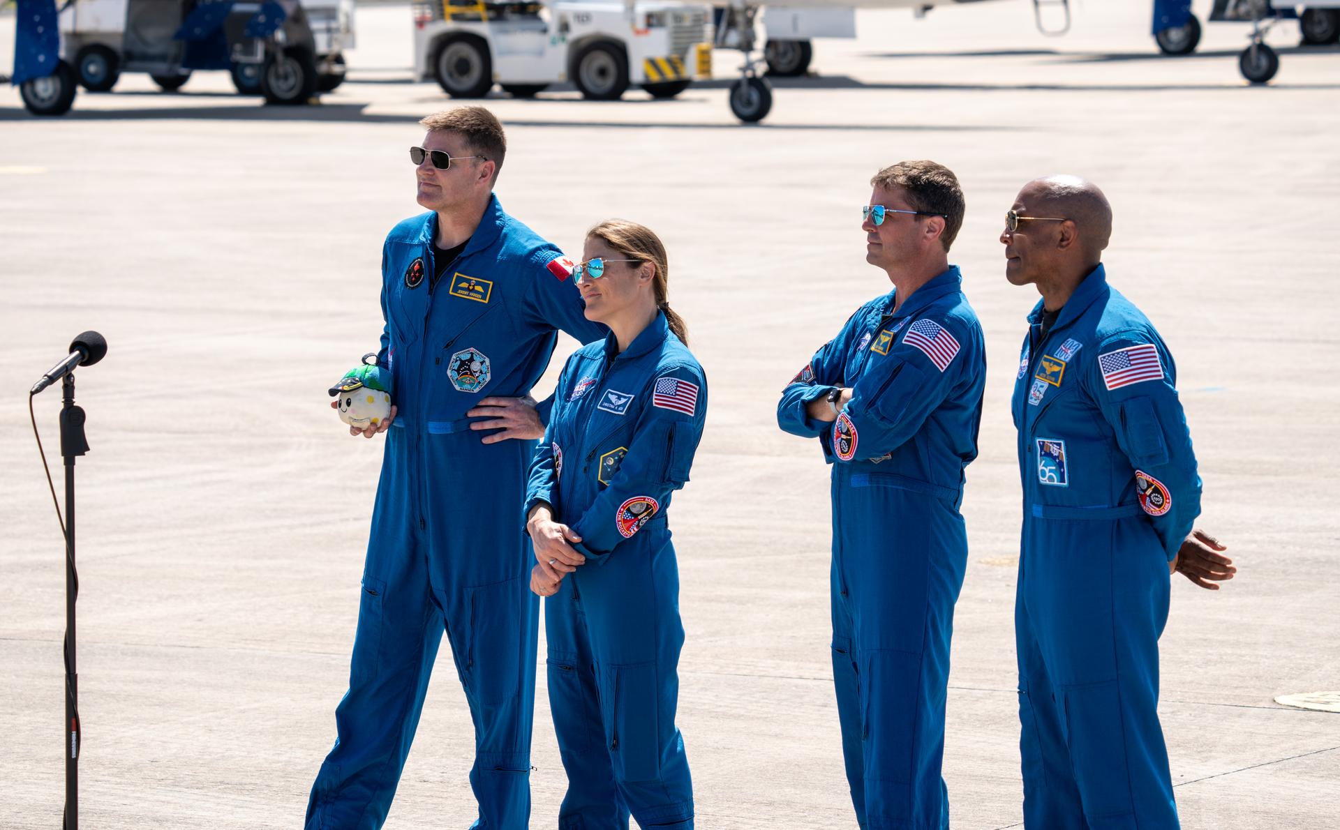 These images show the moments shortly after the arrival of the Artemis II crew to NASA’s Kennedy Space Center on March 27, 2026 ahead of the launch. The four astronauts, Victor Glover, Reid Wiseman, Christina Koch, and Jeremy Hansen, arrived on a T38, which can be seen behind them. They took turns speaking to the crowd as they also announced the zero-gravity indicator they would be taking with them on their journey.